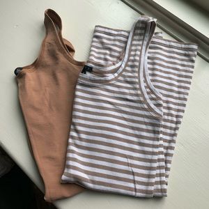 Two Theory tanks! One tight lycra one strip cotton